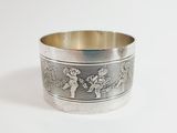 silver plated bracelet with a design of a man and a woman on a horse