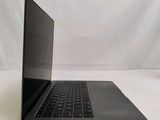 a laptop that is sitting on a white surface