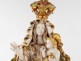 an image of a statue of a woman holding a child