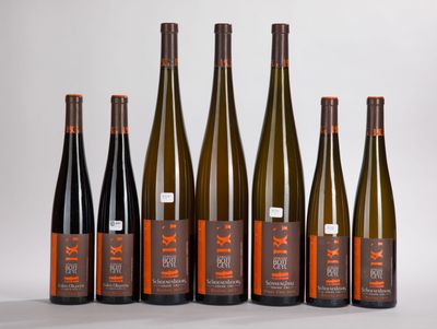 six bottles of wine are lined up in a row