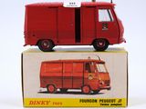 a red toy truck that is sitting on top of a box