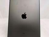 the back of an ipad with a black apple logo on it
