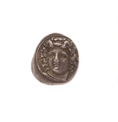 une image d'une pièce de monnaie sur laquelle figure le visage d'un homme