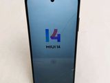 a close up of the back of a phone with a broken screen