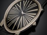 a close up of a watch on a black surface with diamonds