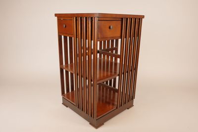 an image of a wooden bookcase with a drawer