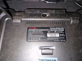 an image of a car ' s battery compartment with a sticker on it