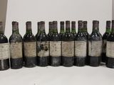 several bottles of wine are lined up in a row on a table