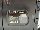 a close up of a camera on a white surface