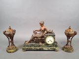 a statue of a woman sitting on a table next to a clock