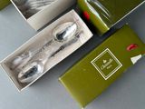 two spoons and a fork in a box