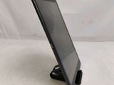 a tablet that is sitting on a stand on a table