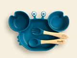 a blue plate with two spoons and two spoons in the shape of a crab