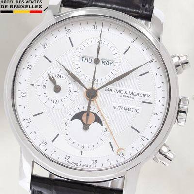a close up of a wrist watch with a white dial