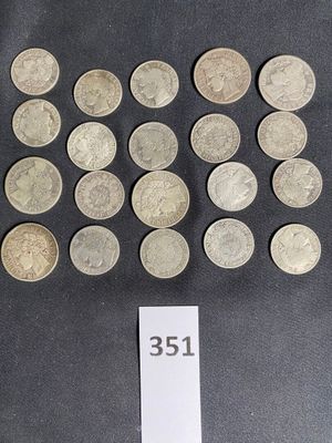 a lot of coins on a table with a price tag