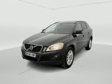 the volvo suv is parked in a white room with a white floor