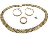 a close up of a necklace, bracelet and ring on a white background