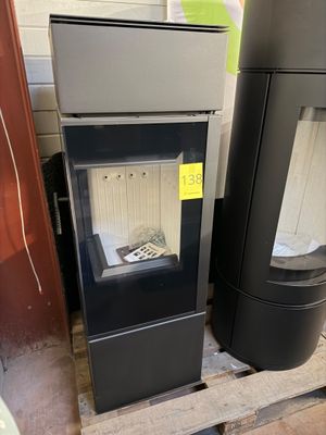 two stoves sitting next to each other on a pallet