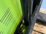 a close up of a green door with a chain on it