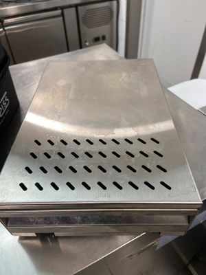 a stainless steel counter top with a box on top of it
