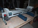 a machine that is sitting on top of a wooden table