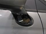 a close up of a car ' s door handle with a key in it