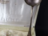 silverware in a box with a spoon and fork inside of it