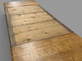 an image of a long wooden table with a blue edge