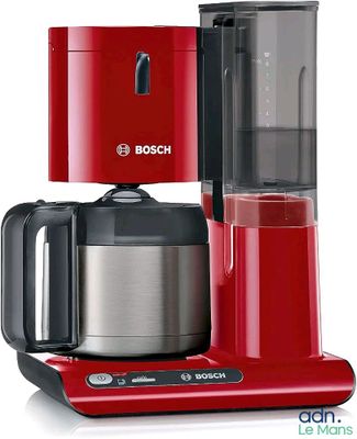 red coffee maker with a glass carafeo in front of it