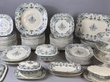 many different types of blue and white plates on the table