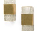 pair of wall sconces with gold and white marble panels