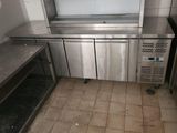 a stainless steel counter top in a commercial kitchen
