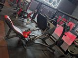 a gym with a lot of equipment in the room