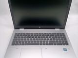 an open laptop computer sitting on top of a white table