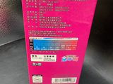 the pink box is open on a black surface