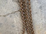 a chain hanging from the ceiling of a bathroom