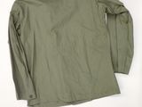 the back of a green jacket on a white background