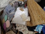 a pile of clothes and other items that are in a box