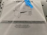 a plastic bag with a blue handle on top of a table