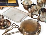 a lot of silver items that are on the table