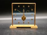 a small clock that is sitting on a table
