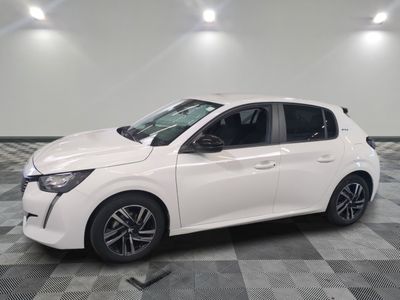 the white car is parked on a checkered floor in the garage