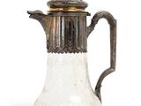 an antique silver and glass coffee pot with a lid