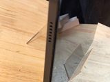 a cell phone sitting on top of a wooden table