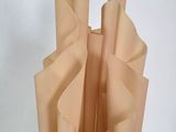 a vase that has a bunch of folded paper in it