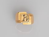 an image of a gold ring with a square design on it