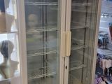 a refrigerator that is sitting in the middle of a store