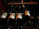 many bottles of wine sitting on a shelf in a wine cellar