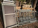 a metal rack with a guitar and a speaker on top of it