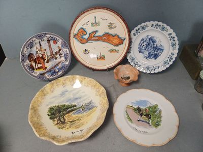 a lot of plates that are sitting on a table